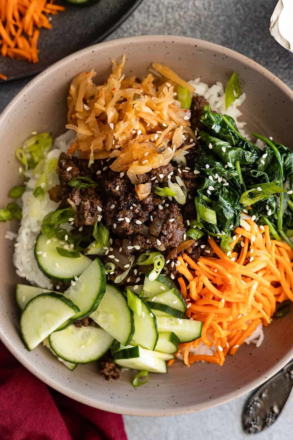 Overhead view of Korean ground beef bowl sprinkled with sesame seeds.